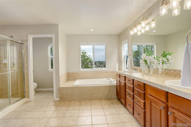 23427 Song Bird Hills Pl, Parker, CO 80138 - bathroom with double vanity, toilet, tile patterned floors, a stall shower, and recessed lighting
