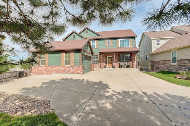 23427 Song Bird Hills Pl, Parker, CO 80138 - view of front of property with brick siding, a porch, and concrete driveway