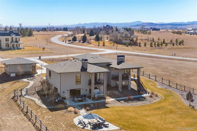 drone / aerial view featuring a rural view and a mountain view