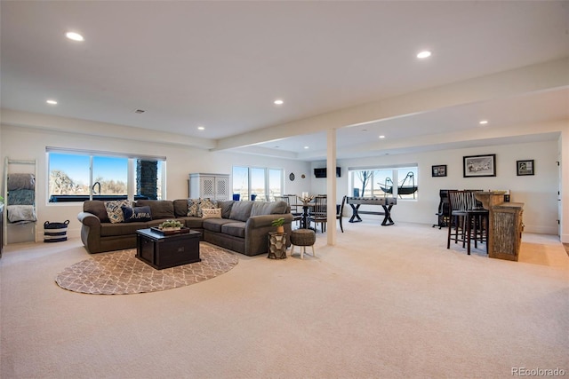 living room with recessed lighting and carpet floors