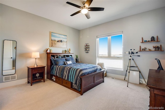 bedroom featuring visible vents, carpet floors, baseboards, and a ceiling fan