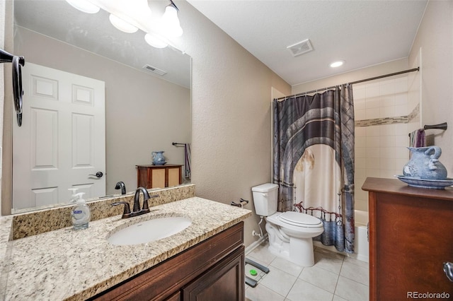 full bathroom with tile patterned flooring, shower / bath combo, toilet, and vanity