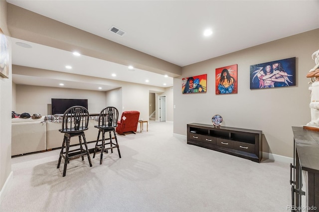 dining room with light colored carpet