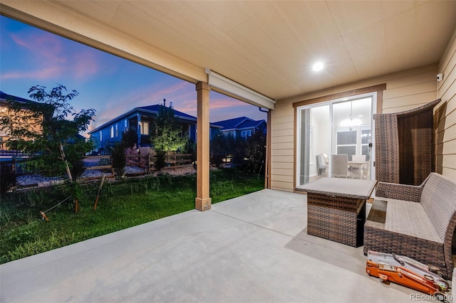 patio terrace at dusk with a yard