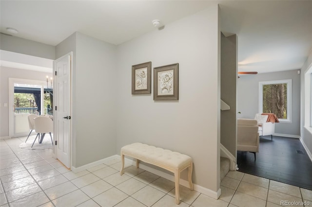 corridor featuring light tile patterned floors