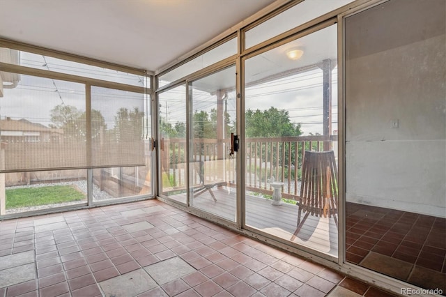 2196 W 56th Ave, Denver, CO 80221 - unfurnished sunroom featuring floor to ceiling windows and tile patterned floors
