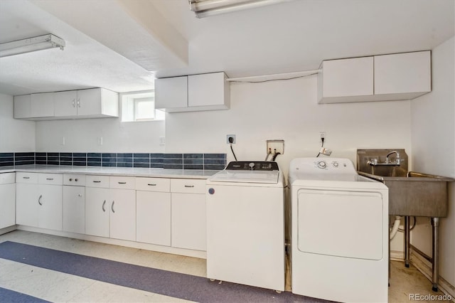 2196 W 56th Ave, Denver, CO 80221 - washroom featuring separate washer and dryer and cabinet space