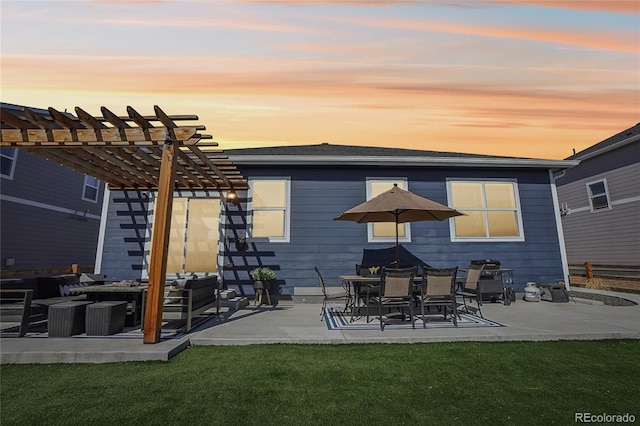 rear view of house featuring a patio, a pergola, and a yard