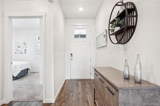 interior space featuring wood finished floors and baseboards