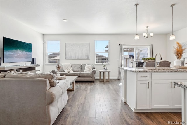 living room with dark wood finished floors and baseboards