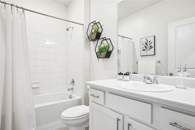 full bath featuring vanity, toilet, and shower / tub combo