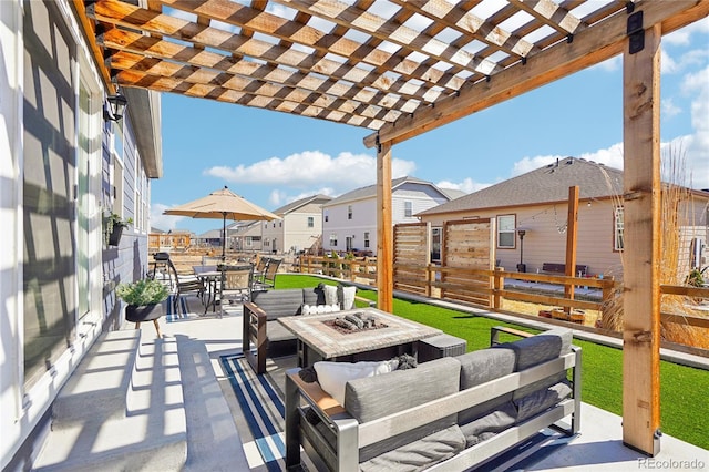 view of patio / terrace featuring an outdoor living space with a fire pit, fence, a residential view, outdoor dining area, and a pergola