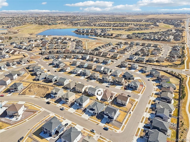 birds eye view of property with a residential view and a water view