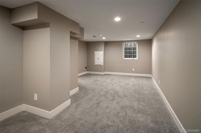 below grade area featuring recessed lighting, baseboards, and carpet