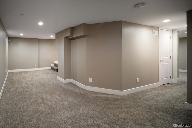 finished basement with carpet flooring, recessed lighting, and baseboards