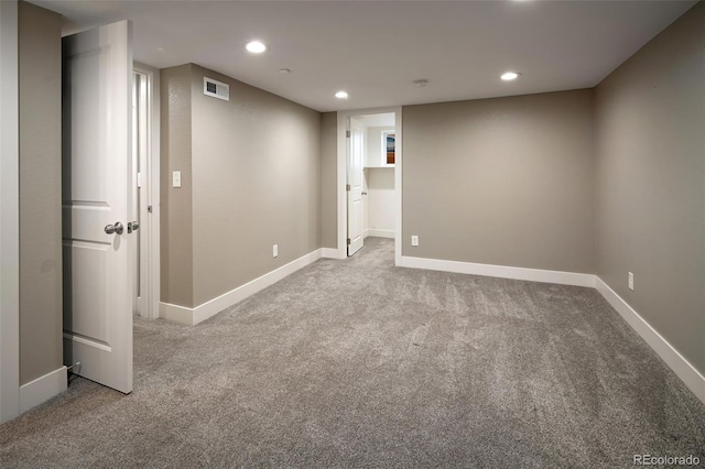 finished below grade area with recessed lighting, baseboards, visible vents, and carpet floors