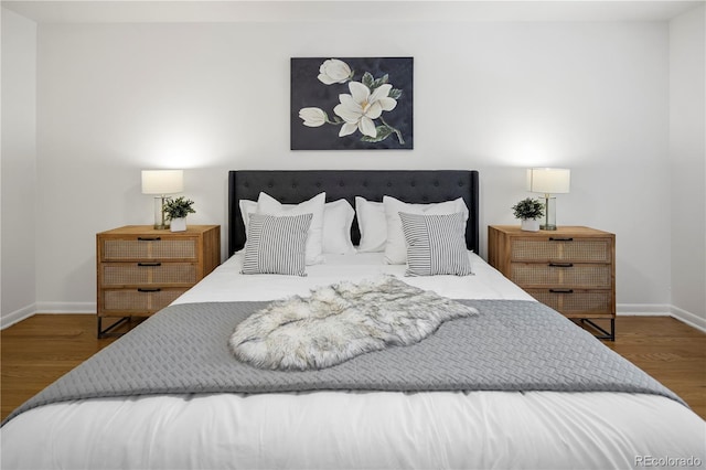 bedroom featuring dark hardwood / wood-style flooring