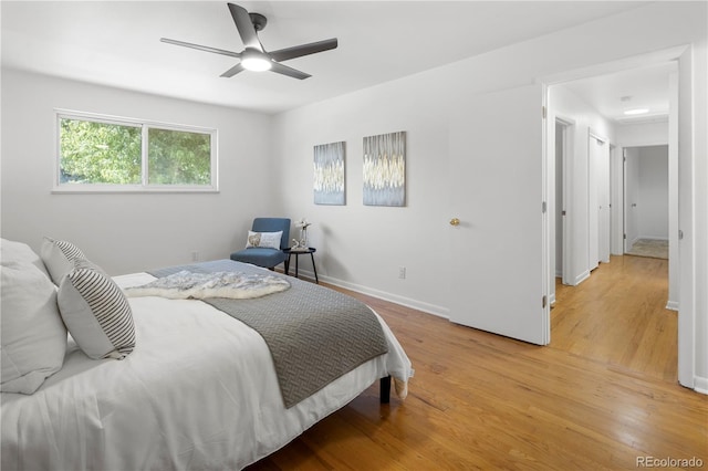 bedroom featuring ceiling fan and wood-type flooring