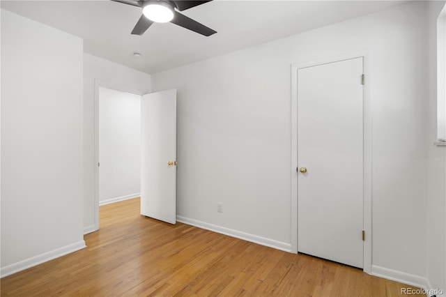 unfurnished bedroom featuring light hardwood / wood-style floors and ceiling fan