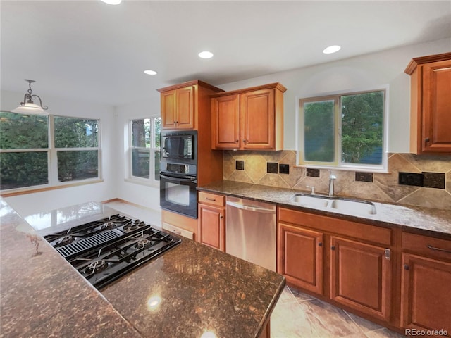 584 W Prestwick Way, Castle Rock, CO 80104 - kitchen featuring black appliances, a sink, decorative backsplash, brown cabinetry, and recessed lighting