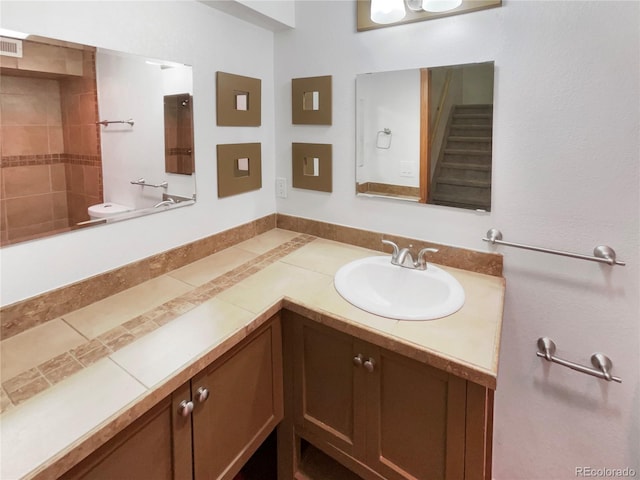 584 W Prestwick Way, Castle Rock, CO 80104 - bathroom with vanity, a shower, and toilet