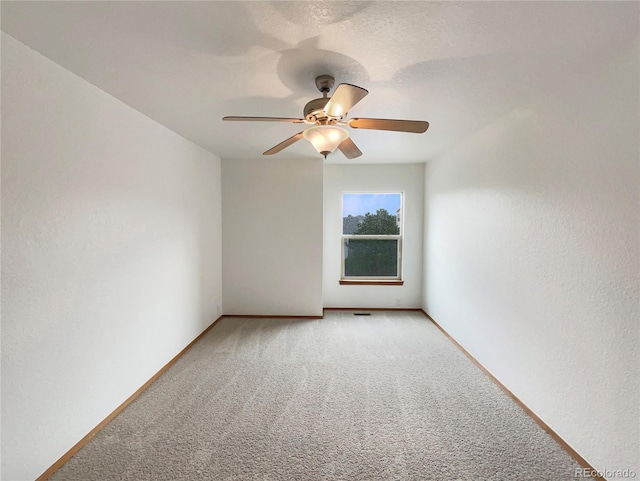 584 W Prestwick Way, Castle Rock, CO 80104 - spare room with light colored carpet, a ceiling fan, and baseboards