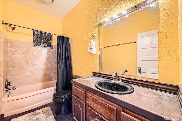 full bathroom with a textured wall, shower / bath combination with curtain, and toilet