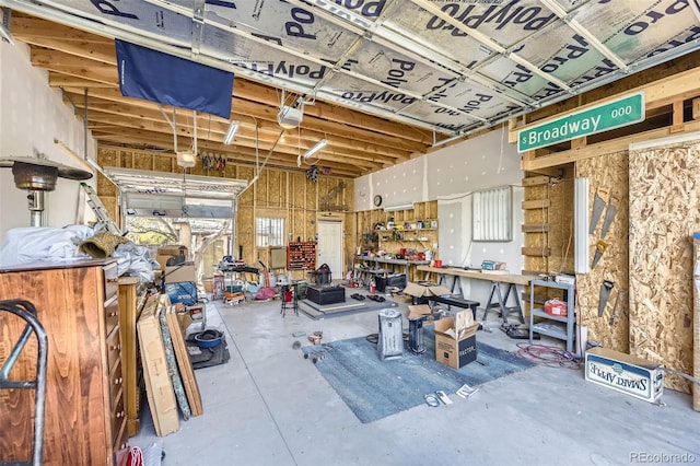 garage featuring a workshop area and a garage door opener