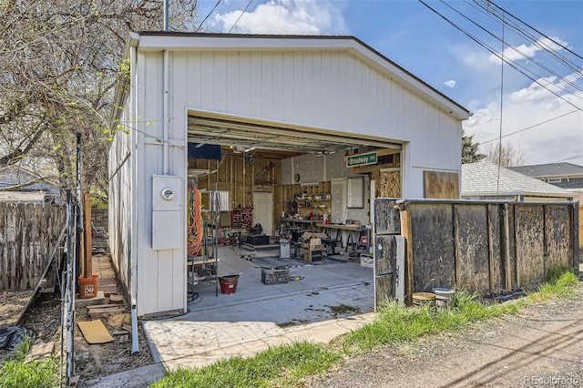 view of outdoor structure featuring fence and an outdoor structure