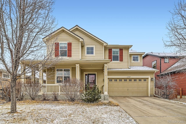 view of front of home featuring a garage and covered porch