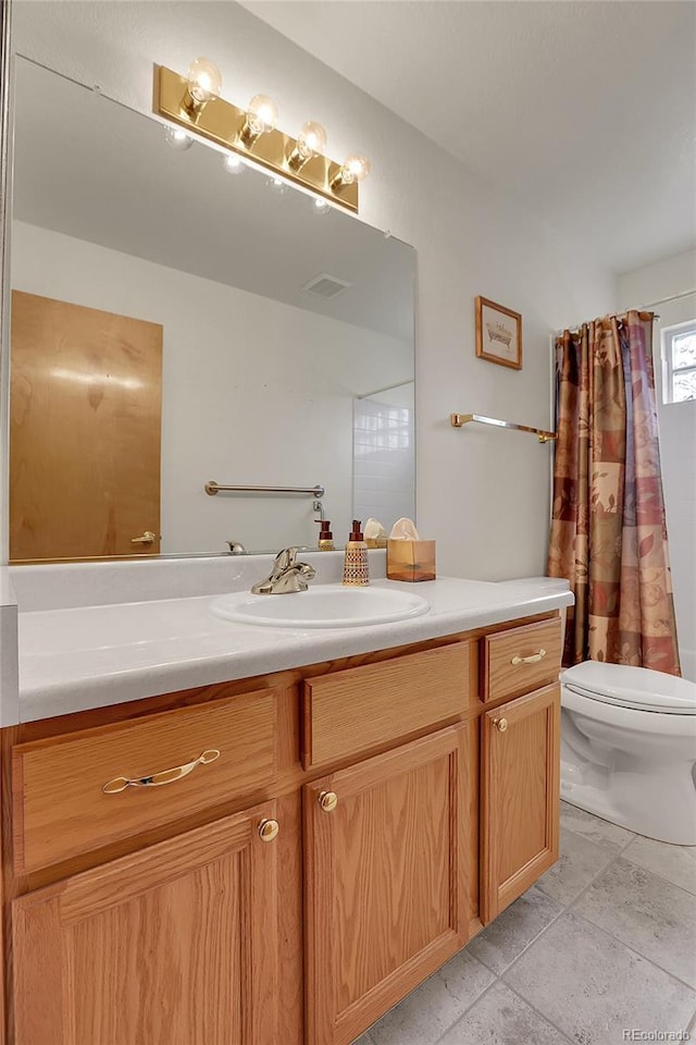 full bathroom with visible vents, vanity, and toilet