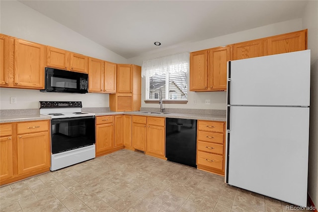 kitchen featuring lofted ceiling, black appliances, a sink, and light countertops