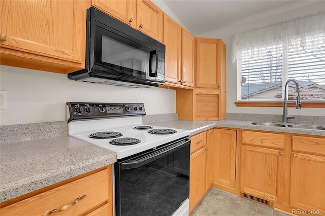 kitchen with light tile patterned floors, visible vents, range with electric cooktop, black microwave, and a sink