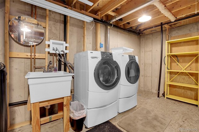 washroom with laundry area and washer and dryer