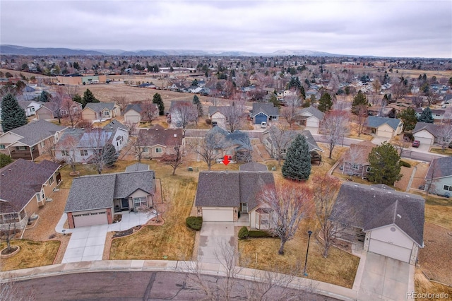 drone / aerial view featuring a mountain view and a residential view