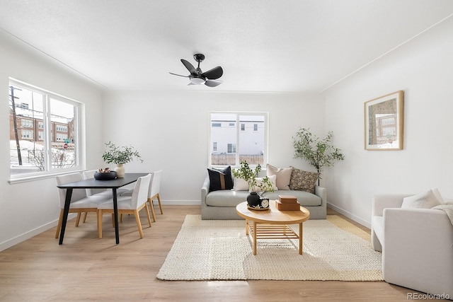 living room featuring light wood-style floors and baseboards