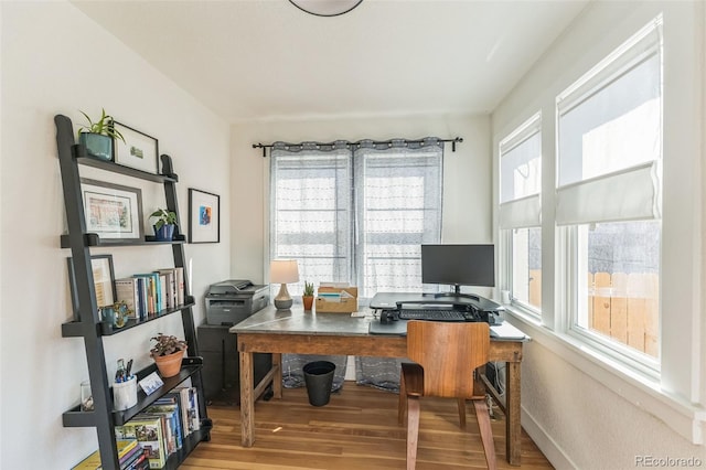 office featuring baseboards and wood finished floors