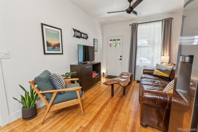 3329 N High St, Denver, CO 80205 - living room with a ceiling fan and light wood-style floors