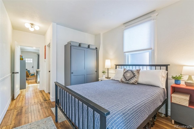 3329 N High St, Denver, CO 80205 - bedroom with baseboards and wood-type flooring
