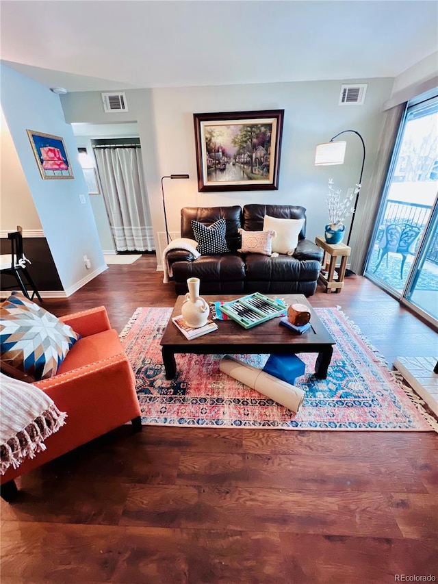 living room with dark hardwood / wood-style floors