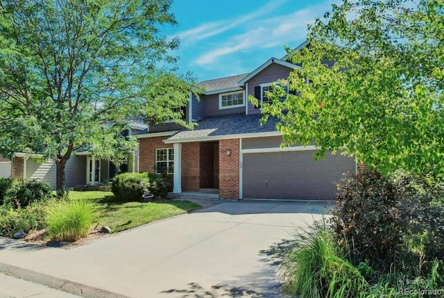 view of front of property with a front yard and a garage