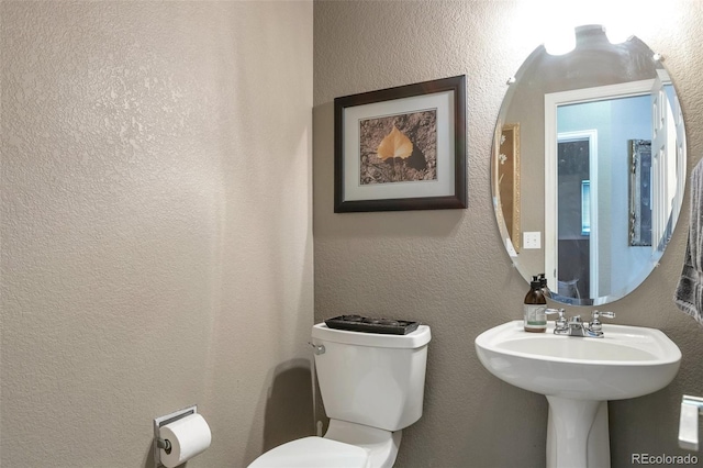 bathroom featuring toilet