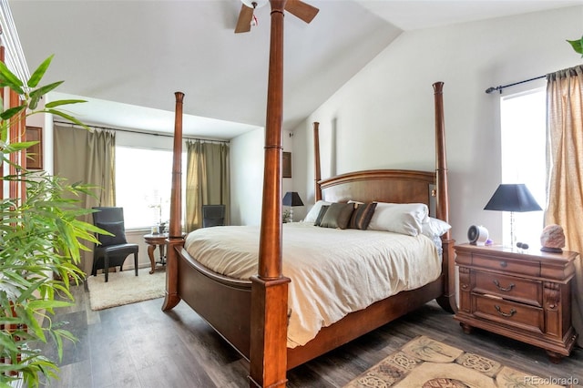 bedroom featuring dark hardwood / wood-style floors, ceiling fan, and lofted ceiling