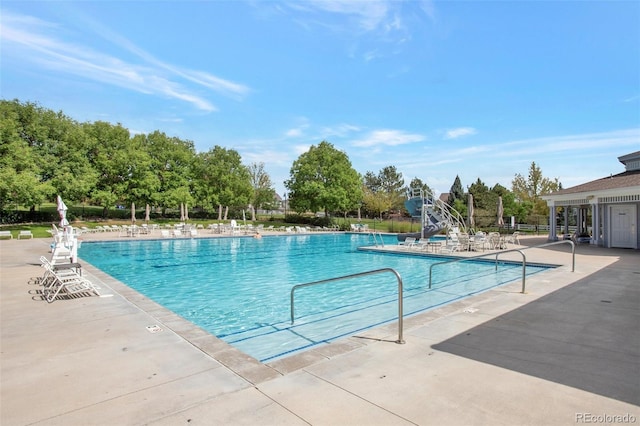 view of swimming pool with a patio area