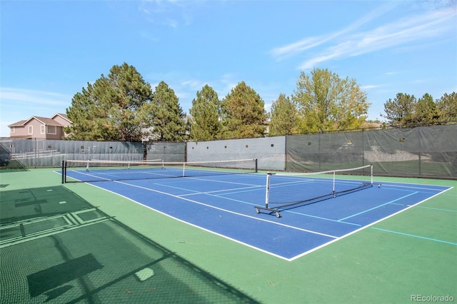 view of sport court with basketball hoop