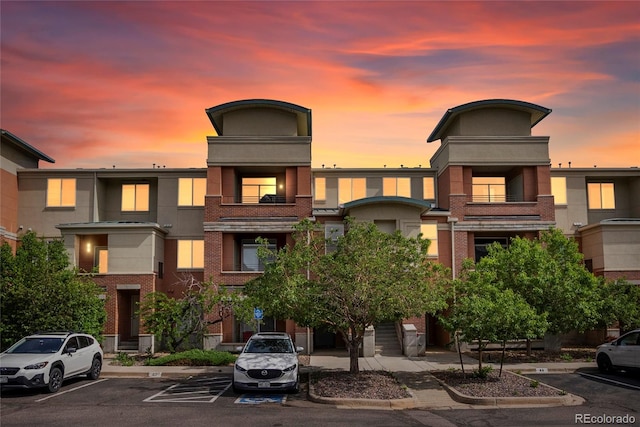 4100 Albion St Unit 424, Denver, CO 80216 - property at dusk with uncovered parking