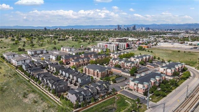 4100 Albion St Unit 424, Denver, CO 80216 - aerial view of property and surrounding area featuring mountains and nearby urban area