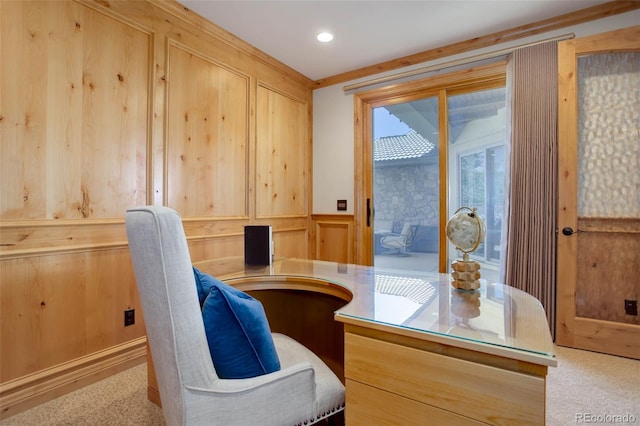 carpeted office with wooden walls