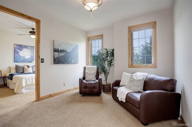 sitting room featuring carpet flooring and ceiling fan