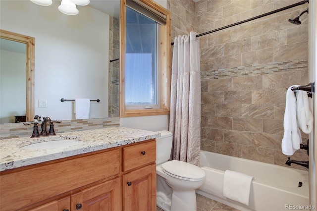 full bathroom featuring tile patterned flooring, shower / bath combination with curtain, vanity, and toilet